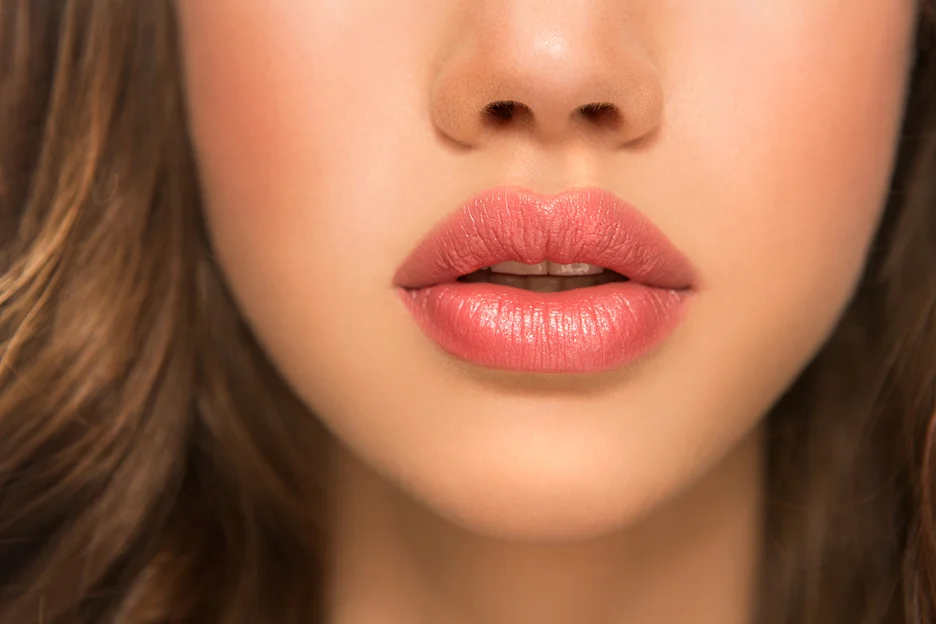 a portrait of a woman with full, plump lips