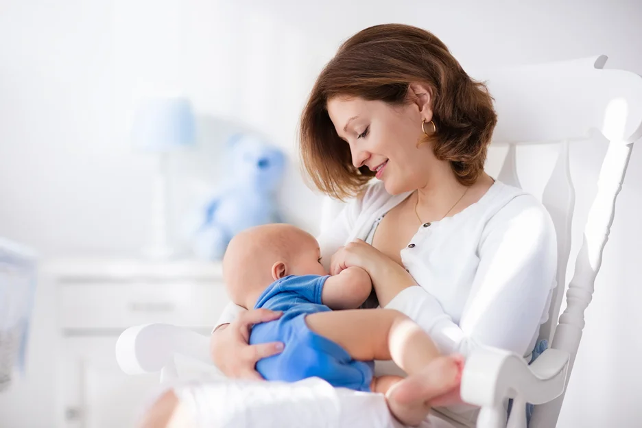 a nursing mother and baby