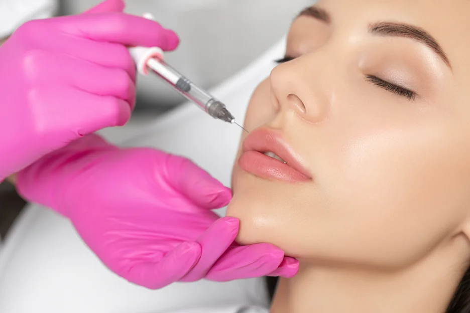 a medical provider injects lip filler into the vermilion border of the lips